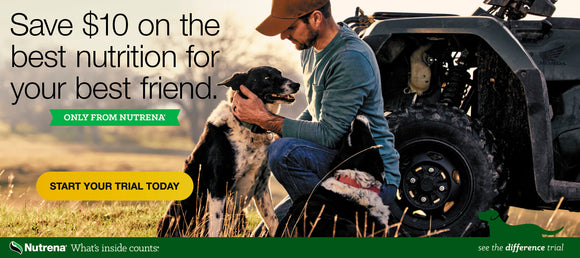 A man kneels in a field, lovingly holding a black and white dog near an ATV. The ad promotes a $10 savings on Nutrena pet nutrition, encouraging a trial offer with the text 'Save $10 on the best nutrition for your best friend. Only from Nutrena. Start your trial today.' Nutrena logo and tagline 'What's inside counts' appear at the bottom.